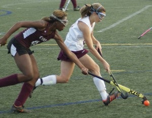King’s Fork High School junior Hannah Washburn looks to out-pace the Heritage High School defender during Tuesday’s opening round of the Ironclad Conference tournament at Christopher Newport University. (Caroline LaMagna photo)