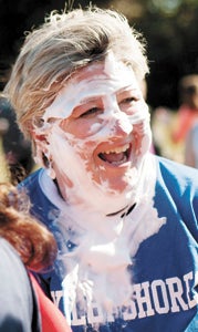 Lori Mounie, principal of Kilby Shores Elementary School, got (shaving cream) pie on her face Friday. Students threw the pie to raise money for United Way.