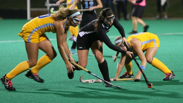 Lakeland High School senior forward Summer Parker splits the First Colonial High School defenders during Monday night's showdown at the U.S. Field Hockey National Training Center. Parker scored twice to get her team back in the game, leading to a season-defining 4-3 overtime win for the Lady Cavaliers.