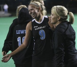 Shortly after scoring the winning goal in overtime against First Colonial High School, Lakeland High School senior midfielder Kristen Vick celebrates with head coach Tara Worley on Monday night at the U.S. Field Hockey National Training Center.