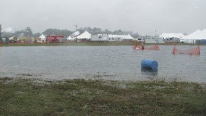 A lake in the middle of the Suffolk Executive Airport provided an illicit route to the closed Shrimp Feast for some who walked through it to get to the canceled event.