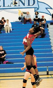 Nansemond River High School senior middle blocker/hitter Tatyana Thomas sizes up a potential kill on Thursday night against host Lakeland High School. She had 16 kills, no errors and six blocks in the four-set win over the Lady Cavs that ended around 10:30 p.m. due to transportation delays and an over-run in the boys’ preceding game.