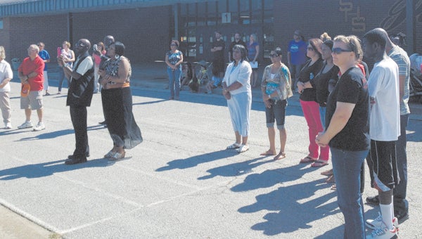 The Circle of Solidarity group holds a previous prayer event at Smithfield High School. The group will pray at Nansemond River High School this Saturday, and all are invited to join them.
