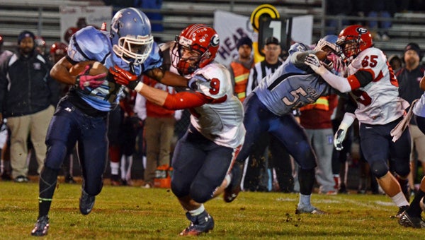 Lakeland High School senior running back Curtis Rouse tries to fend off a Grassfield High School defender in the Cavaliers' final game of the 2013 season. Lakeland hung with the visiting, Group 6A South playoff-bound Grizzlies early, but ultimately lost 29-12. (Melissa Glover photo)