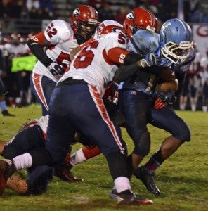 Lakeland High School junior running back Ja'Juan Walker braces himself as defenders from visiting, Group 6A South playoff-bound Grassfield High School collapse on him Friday night. The Cavs finished 1-9 this year with a 29-12 loss to the Grizzlies. (Melissa Glover photo)
