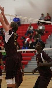 King's Fork High School's Cal Bailey, left, and Dale Roscoe patrol the net during the Bulldogs' 4-set win over Heritage High School in the Ironclad Conference 18 tournament title game on Thursday at Nansemond River High School. Roscoe had 11 kills and nine blocks while Bailey had six kills and 25 assists.