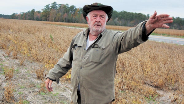 Ivor farmer L. A. Brantley Jr. stands where a new road proposed by VDOT as a tolled, limited-access alternative to the existing Route 460 would cut through the land he says has been in his family since about 1900. 