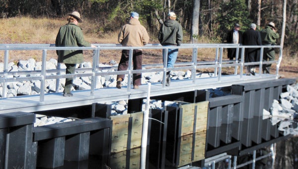 By adding and removing flashboards, two new weirs control the flow of water into a section of the Great Dismal Swamp via the South Martha Washington Ditch. 