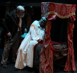 Ebenezer Scrooge is visited by the ghost of his former business partner, Jacob Marley, during a dress rehearsal for Smithfield Little Theatre’s rendition of “A Christmas Carol.” (Photo courtesy of Smithfield Little Theatre)