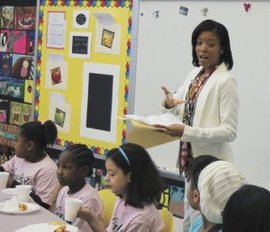 Olympic gold medalist LaTasha Colander Clark imparts advice and inspiration Friday on members of Creekside Elementary School girls-only club, Girls With Pearls. She told them to follow their dreams and recognize their unique gifts.
