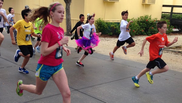  Mickey Miler: Twelve-year-old Betsy Pollard of Suffolk spent part of her Florida vacation placing eighth in the 600-member one-mile race that was part of the 2014 Walt Disney World Marathon Weekend.