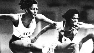 Melleasenah Williams, as she was then known, hurdles for Hampton University in her college days.