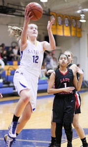 Nansemond-Suffolk Academy sophomore point guard Harper Birdsong vies for two of her career-high 31 points during Tuesday’s quarterfinal win over visiting Walsingham Academy.