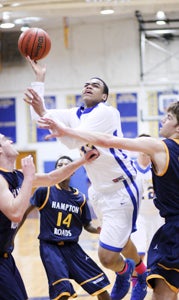 Nansemond-Suffolk Academy junior forward C.J. Patterson looks for two of his 14 points during Tuesday’s last-second 54-51 loss to visiting Hampton Roads Academy. (Janine DeMello photo)