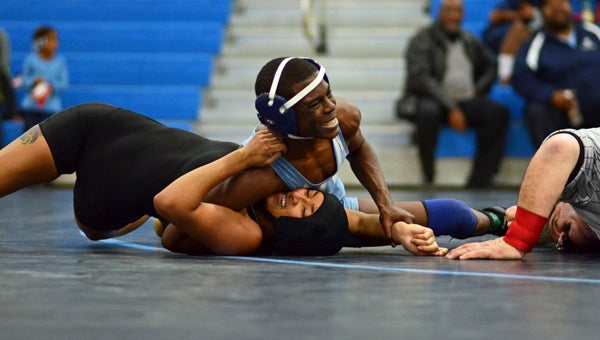 Lakeland High School freshman 113-pounder Kevin Dale wrestles Phoebus High School junior Imari Ramirez on Wednesday.