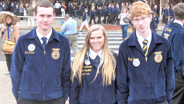 Lakeland Future Farmers of America Chapter members Will March, Katarina Mehalko and Barrett Moore pose outside of the 86th National FFA Convention and Expo in Louisville.