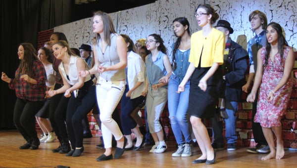 Nansemond-Suffolk Academy theater arts students rehearse for their annual musical, “Little Shop of Horrors.” Three shows are planned for Friday and Saturday. 