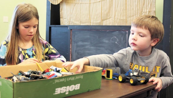 Emily Simmons, 9, and Christopher Langford, 5, were among a group of children at North Suffolk Library Wednesday participating in a Lego Club that meets there, as well as at Morgan Memorial Library in downtown Suffolk, twice monthly.