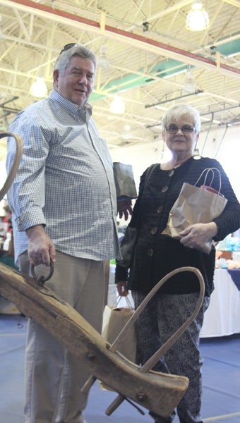 Surry’s Warren and Rosemary Green left the Antiques Show and Sale at King’s Fork Middle School on Saturday with several items. The sale, an annual fundraiser for the Suffolk Art League, continues today. (Matthew A. Ward/Suffolk News-Herald)