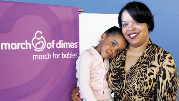 Sanaa Darden, 6, the March of Dimes’ March for Babies 2014 Suffolk ambassador, poses for a photo with mom, Titania Darden, during a kickoff breakfast for the walk in Suffolk, held at QVC Distribution Center on Friday.