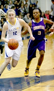 Nansemond-Suffolk Academy sophomore point guard Harper Birdsong drives during the Lady Saints’ 67-31 state quarterfinal win over visiting Norfolk Christian High School on Wednesday.