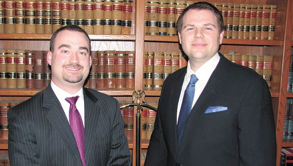 Fred Taylor, left, and Justin Bush are the founders and partners of new law firm Bush and Taylor. They have moved into the former Pender and Coward office on West Washington Street.