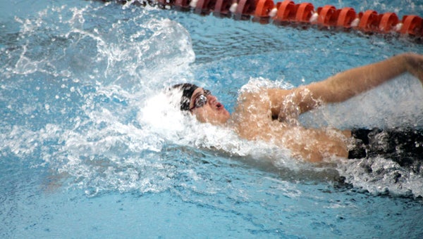 Nansemond River High School sophomore Logan Eubanks swims the 100-yard backstroke over the weekend at the state championships, where he won, setting a new Virginia record.