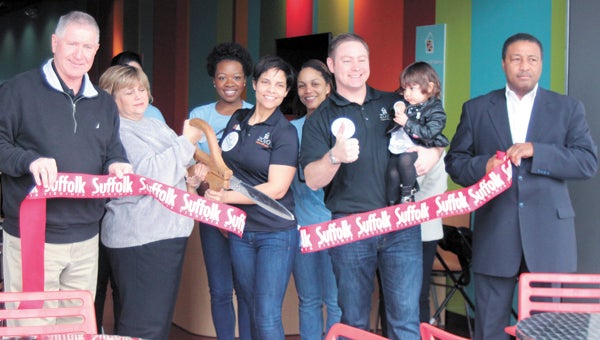 Suffolk’s newest frozen yogurt store, Zoyo Neighborhood Yogurt, held a ribbon-cutting ceremony Wednesday. Owner Isaura Ramirez cuts the ribbon with Mayor Linda T. Johnson. Ramirez’ husband, Armando Velasquez, holding the couple’s daughter, Alana Velasquez, gives the new store the thumbs-up. Also participating in the ceremony are Suffolk councilmen Roger Fawcett and Lou Ward, seen on the far left and far right, respectively, as well as Ebony Batson and Veronica Sanchez. The new business at 6216 College Drive offers a “constantly changing selection of frozen fruit yogurt and toppings,” according to a news release. One-quarter of Wednesday’s takings were donated to For Kids, a nonprofit helping homeless children and families in Hampton Roads.