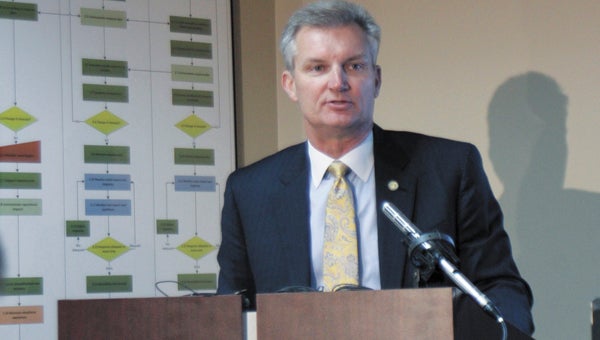 During a press conference in Virginia Beach on Friday, state Transportation Secretary Aubrey Layne announces a decision to suspend contracted work on the U.S. Route 460 project.