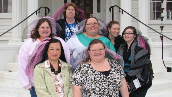 Some of the brides who took Saturday’s limo tour organized by Little Black Dress consignment shop pause for a photo on the steps of the Obici House. They included, front row, Priscilla Hughes and Amanda Davis; middle row, Monjetta Blanchard, Stephanie Jones, Kim Bryant and Amber Hartley; and in back, Susan Milton.
