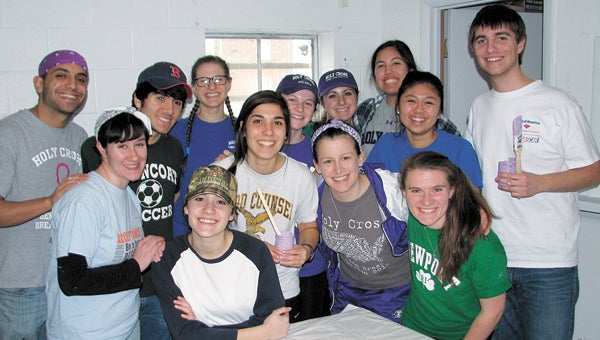 Thirteen students from College of the Holy Cross in Worcester, Mass., are visiting Suffolk this week to do community service at Macedonia African Methodist Episcopal Church on Pine Street. Pictured in the church’s fellowship hall are, from left, Anthony Russo, Emily Conn, Adam Bullock, Amanda Snow, Aliona Olaru, Emily Muldoon, Caitlin Pollard, Rosie Henry, Cassie Maimie, Kamele Shizuru, Carla Burns, Erin Hillis and Tim Konola.