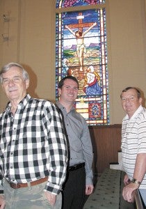 Men from Bethlehem Christian Church show off a stained-glass window in the sanctuary that will soon be repaired. From left are Buck Buchanan, who is on the property and grounds committee; Pastor Matt Winters; and Charles Johnson, a deacon who is also on the property and grounds committee.