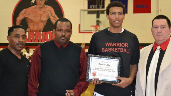 Nansemond River High School's Devon Oakley is recognized for being nominated to play in the 2014 McDonald's All American Games. From left: John Mayer, Antonio Smith, Oakley and Ed Young. (The Moroch Agency)