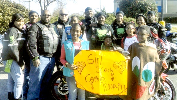 New Girl Scout Troop 944, “The Smarties,” had a busy first cookie season. They had their final cookie booth sale March 15 at the Main Street Applebee’s. Pictured from left are Anaya Nazareth, Harmoni Jean, Jayme Scott and Aulani Jenkins, with the K-9 Motorcycle Club of Virginia Beach behind them.