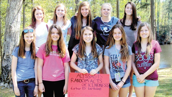 Alyssa Rose, center on the bottom row, invited friends to participate in random acts of kindness last weekend to celebrate her 15th birthday. From left on the bottom row are Carley Peacock, Josie Kremer, Alyssa Rose, Madeline Erickson and Jessica Bruner. From left on the top row are Emma Marston, Alyssa’s sister Alexandra Rose, Camille Brayshaw, Grace Fowler and Ashlyn Newberry.
