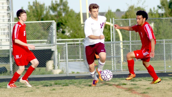 King's Fork High School's Garrett Fuller maneuvers against visiting Lake Taylor High School on Thursday. He contributed strong defense in a 3-1 Bulldog win.