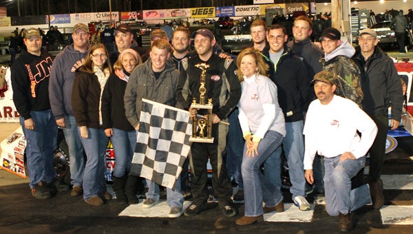 Matt Waltz celebrates in Victory Lane with his family, crew and trophy after his 100-lap win in the Late Model Stock Cars class Saturday in the NASCAR Whelen All-American Series events at Langley Speedway.
