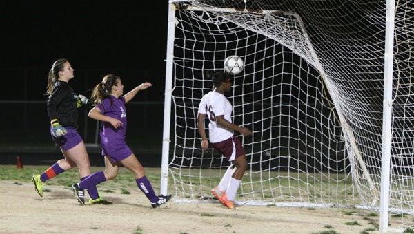 King’s Fork High School freshman Cydney Nichols follows the ball into the goal after scoring during Wednesday’s 6-0 home win over Deep Creek High School.