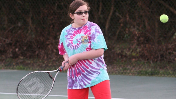 : Zuni's Catherine Hudson, 9, participates Wednesday in the Suffolk tennis program at the Howard Mast Tennis Complex.