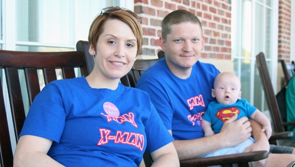 Sheila and Jon Huffman, pictured with 6-month-old Xavier Huffman, were among the most successful fundraisers for the March of Dimes’ March for Babies. (MATTHEW A. WARD/SUFFOLK NEWS-HERALD)