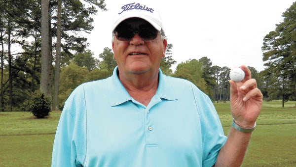 John Bonds Sr. of Suffolk holds up the ball he hit on Thursday at the Suffolk Golf Course to achieve his first ever hole-in-one.