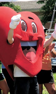 The American Heart Association’s Heart Man mascot cheers on participants at last year’s HeartChase event. This year’s redux is set for May 31.