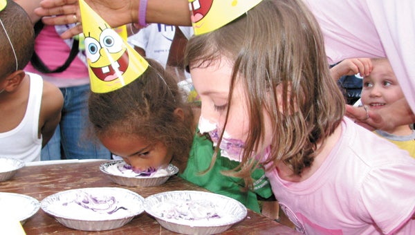 Children participate in a pie-eating contest at the 2010 Suffolk Relay For Life. This year’s Relay, set for Friday and Saturday, will have plenty of activities for children and adults alike, all night long.