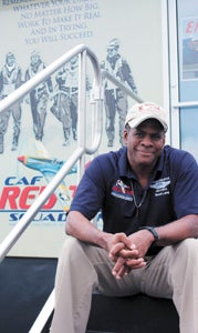 Brad Lang, leader of the Commemorative Air Force Red Tail Squadron, sits on the steps of the Tuskegee Airmen traveling exhibit, a new attraction at this year’s Festival of Flight, this weekend at Suffolk Executive Airport. The squadron is among 70, featuring a combined 156 airplanes, of the Commemorative Air Force.