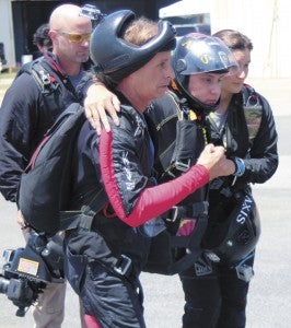 During the Virginia Regional Festival of Flight on Saturday, wounded warrior Joseph Grabianowski en route to the plane for a skydive that will take him another step toward achieving his U.S. Parachute Association A-License, which would allow him to jump without supervision.