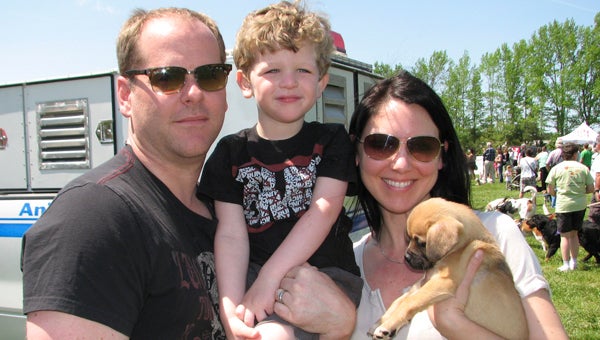 Ben and Anne Jones, with their son Liam, adopted a puppy from Suffolk Animal Control at Sunday’s Mutt Strut fundraiser for the Suffolk Humane Society.