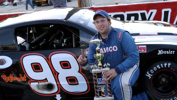Landon Florian of Suffolk holds the trophy for his win in the Pro Six Series class event at Langley Speedway on Saturday. This was Florian’s second 30-lap feature win. (Bill Carr/MotorSports Photo News Service)