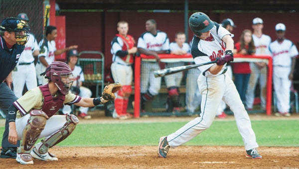 Nansemond River High School senior Chase Williams swings against freshman catcher Tim Gromkoski and visiting King's Fork High School during the Warriors' 10-0 conference tournament championship win on Friday night.