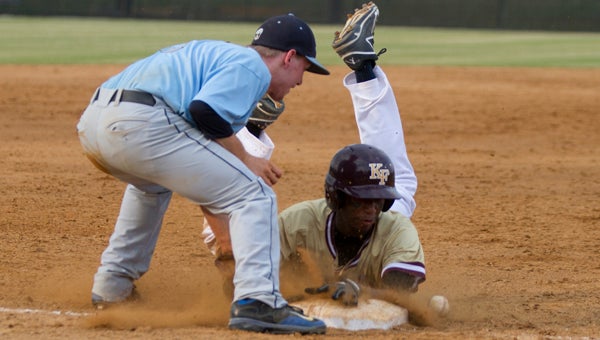 King's Fork High School freshman Ricky McCleod slides into third base during the Bulldogs' 11-1 regional-qualifying conference tournament semifinal win over Lakeland High School on Wednesday at Nansemond River High School. (Jeremy Brant photo)