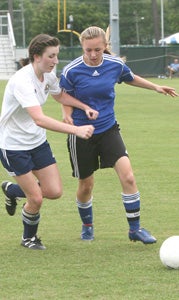 Senior Jenny Rombs battles for possession against a Summit Christian Academy player in Thursday’s 3-0 loss at Christopher Newport University. Rombs provided leadership on defense like she has all season.